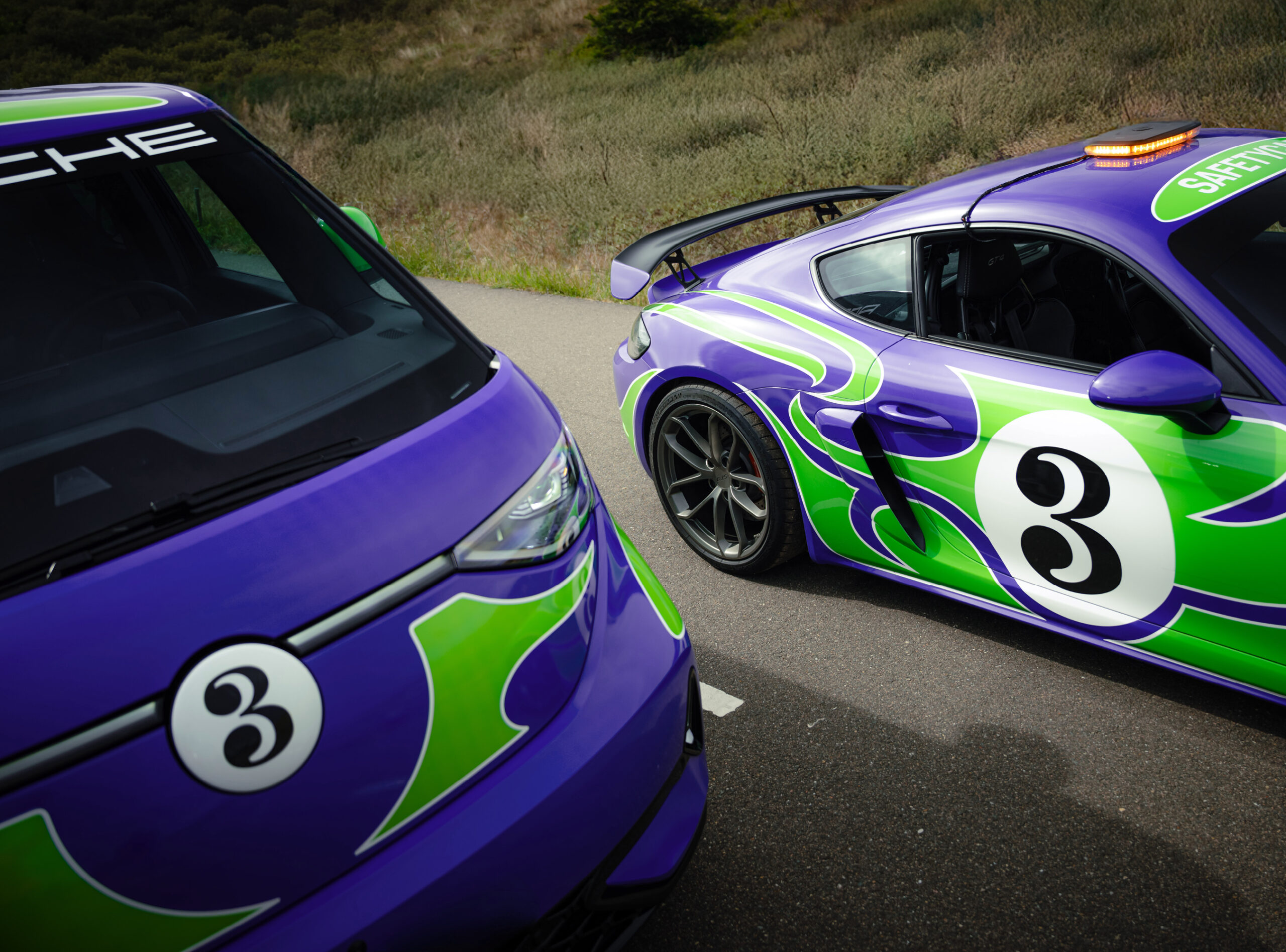 The 'Hippie' livery designed by AGH & Friends on the 718 Cayman GT4 and Volkswagen ID. Buzz.