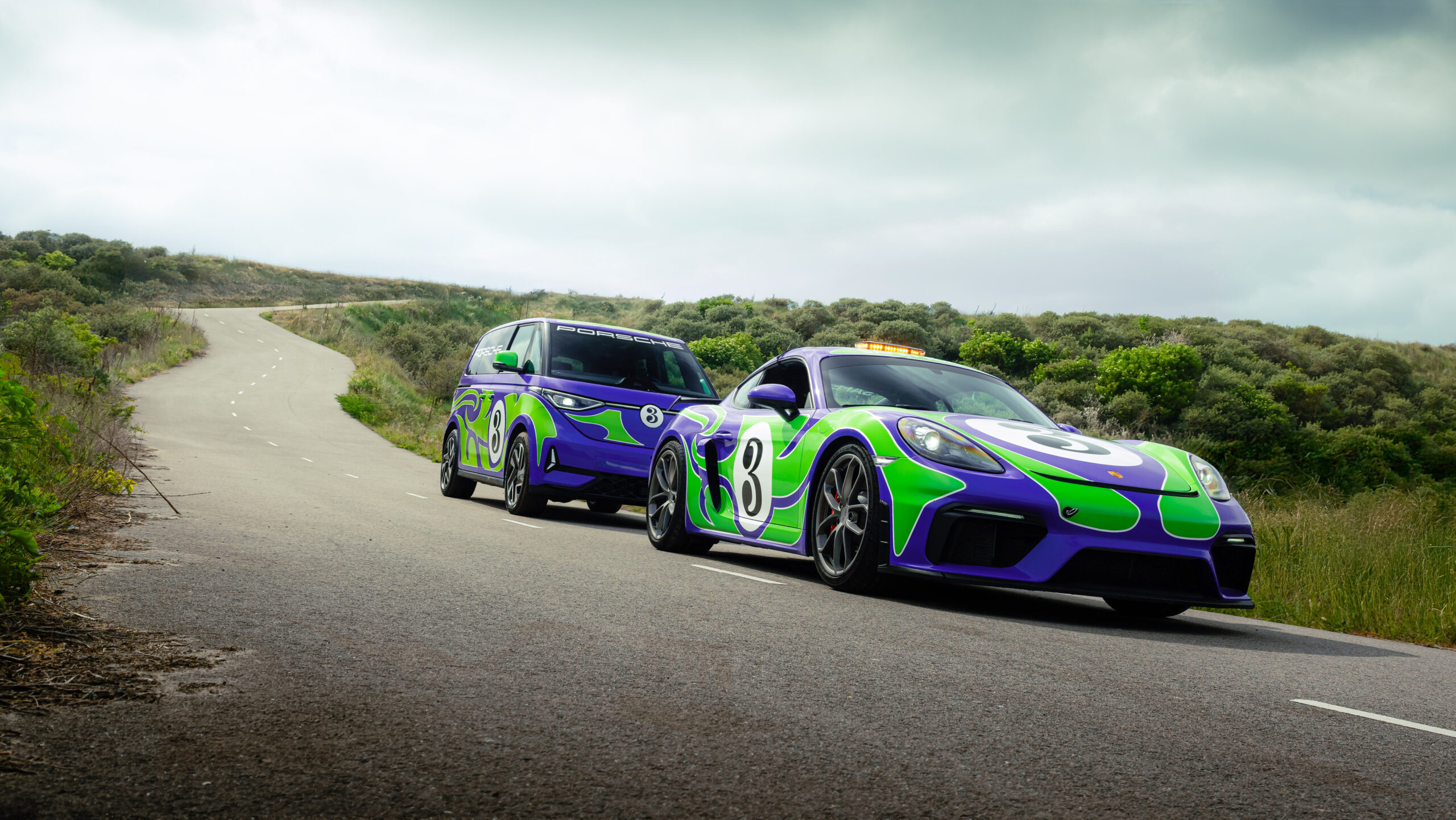 The 'Hippie' livery designed by AGH & Friends on the 718 Cayman GT4 and Volkswagen ID. Buzz.