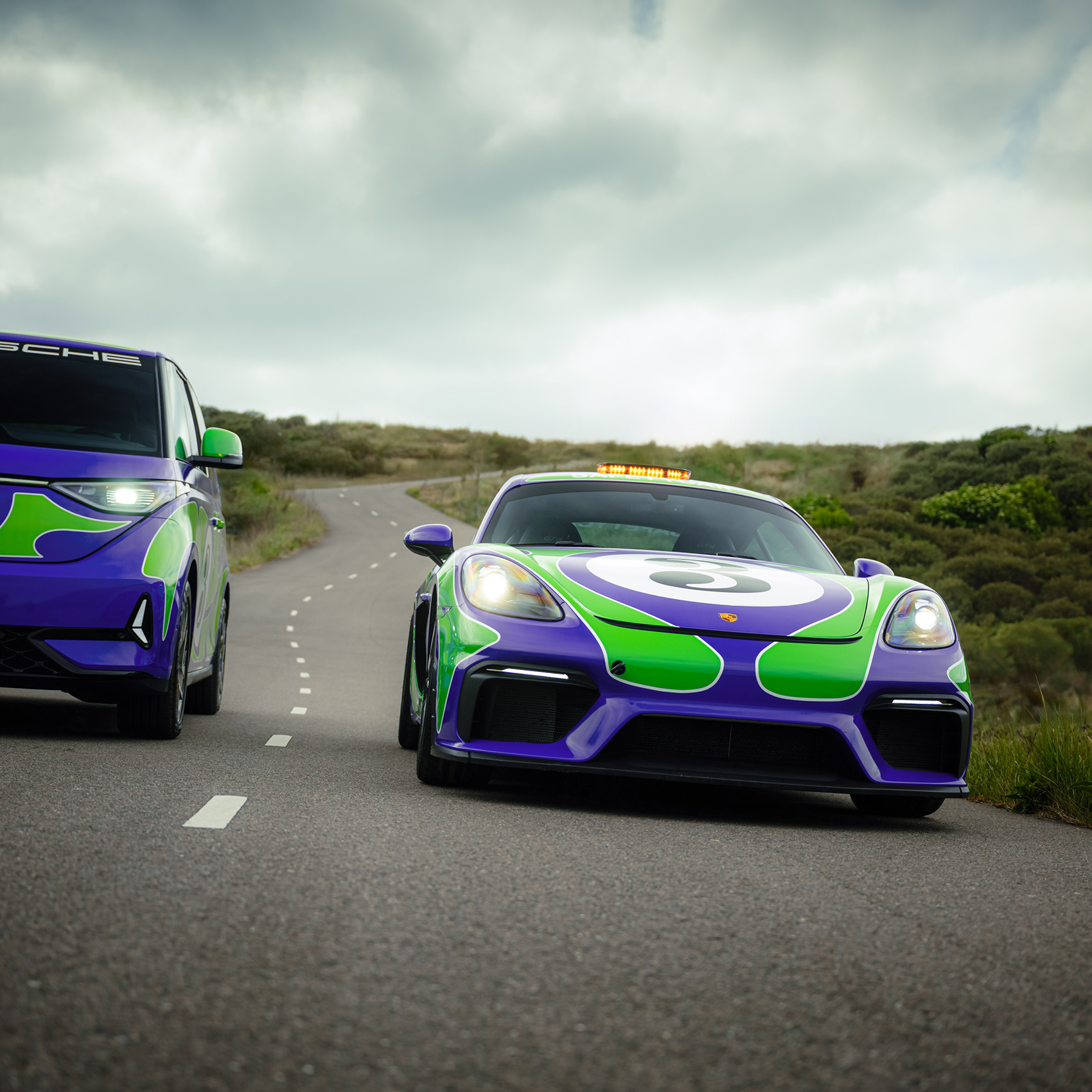 The 'Hippie' livery designed by AGH & Friends on the 718 Cayman GT4 and Volkswagen ID. Buzz.